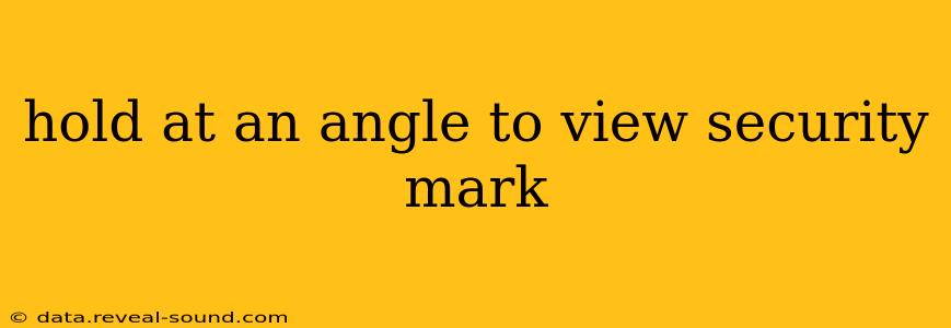 hold at an angle to view security mark