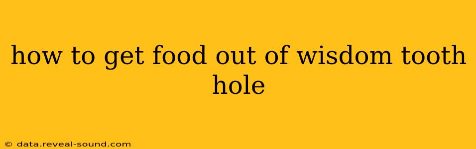 how to get food out of wisdom tooth hole